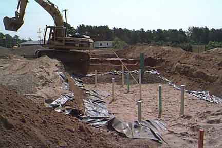Lined Leaching Pit on south side undergoing construction.