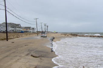 Erosion on Menauhant Rd. which was constructed on the barrier beach south of Great Pond.